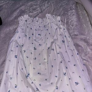 Women white dress with blue flowers.